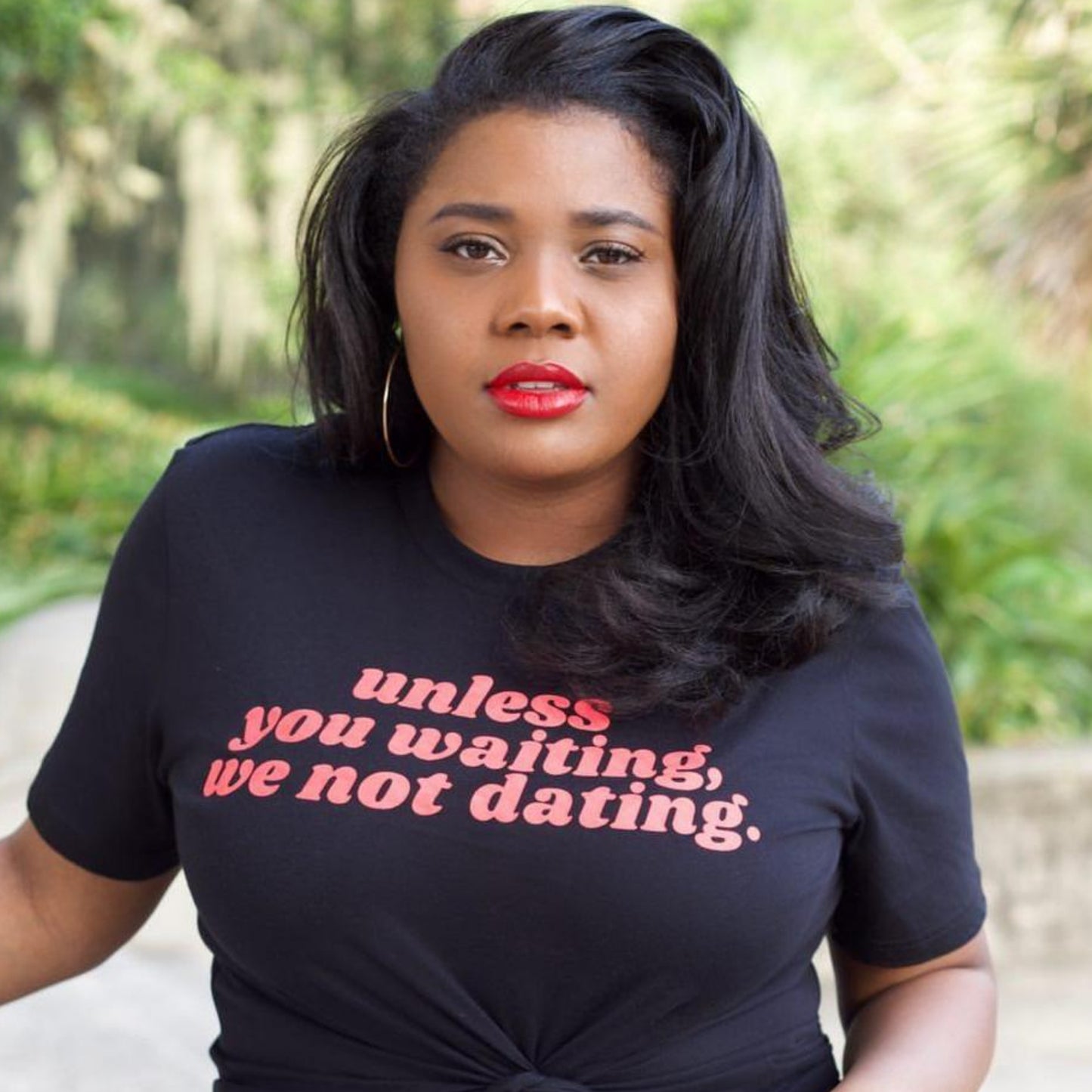 Black Woman wearing Unless you waiting we not dating black unisex t-shirt