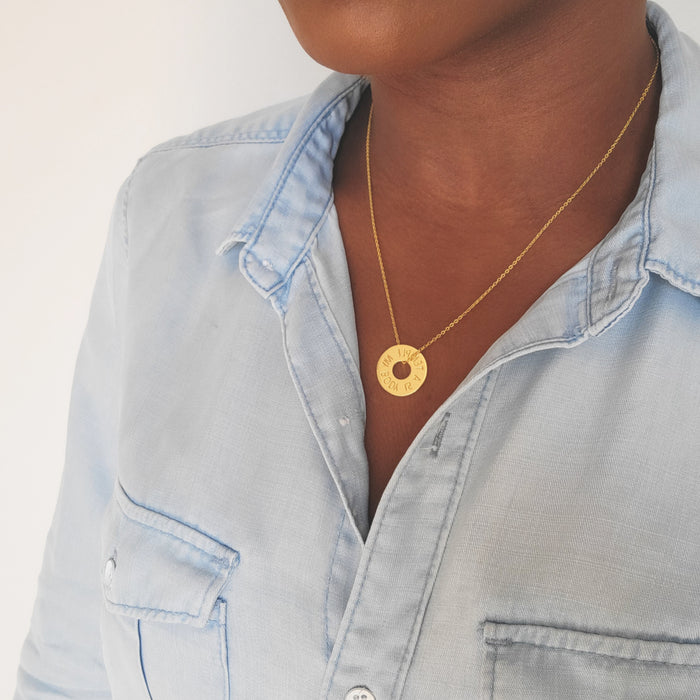Gold My Body Is A Temple Christian necklace with engraved round pendant worn around the neck
